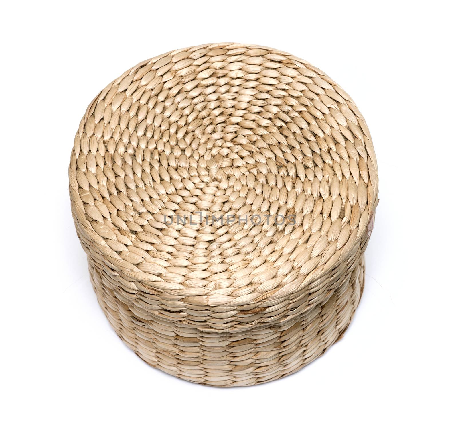 Small closed wicker box isolated on white