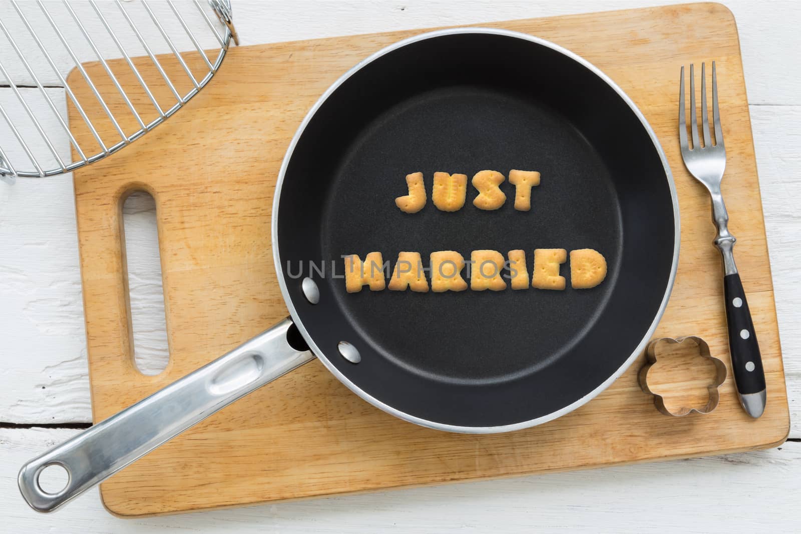 Letter cookies word JUST MARRIED and kitchen utensils by vinnstock