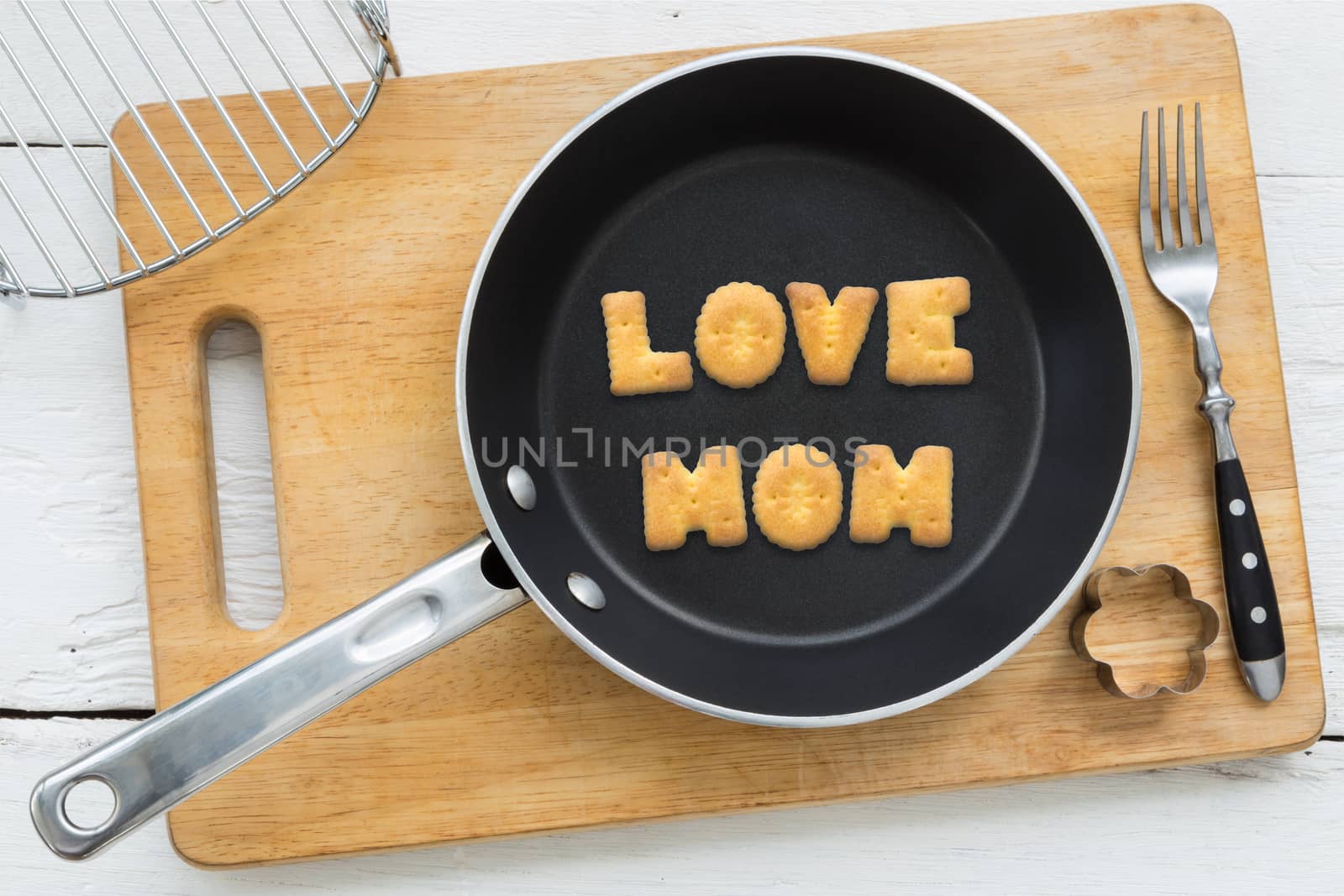 Letter cookies word LOVE MOM and kitchen utensils by vinnstock