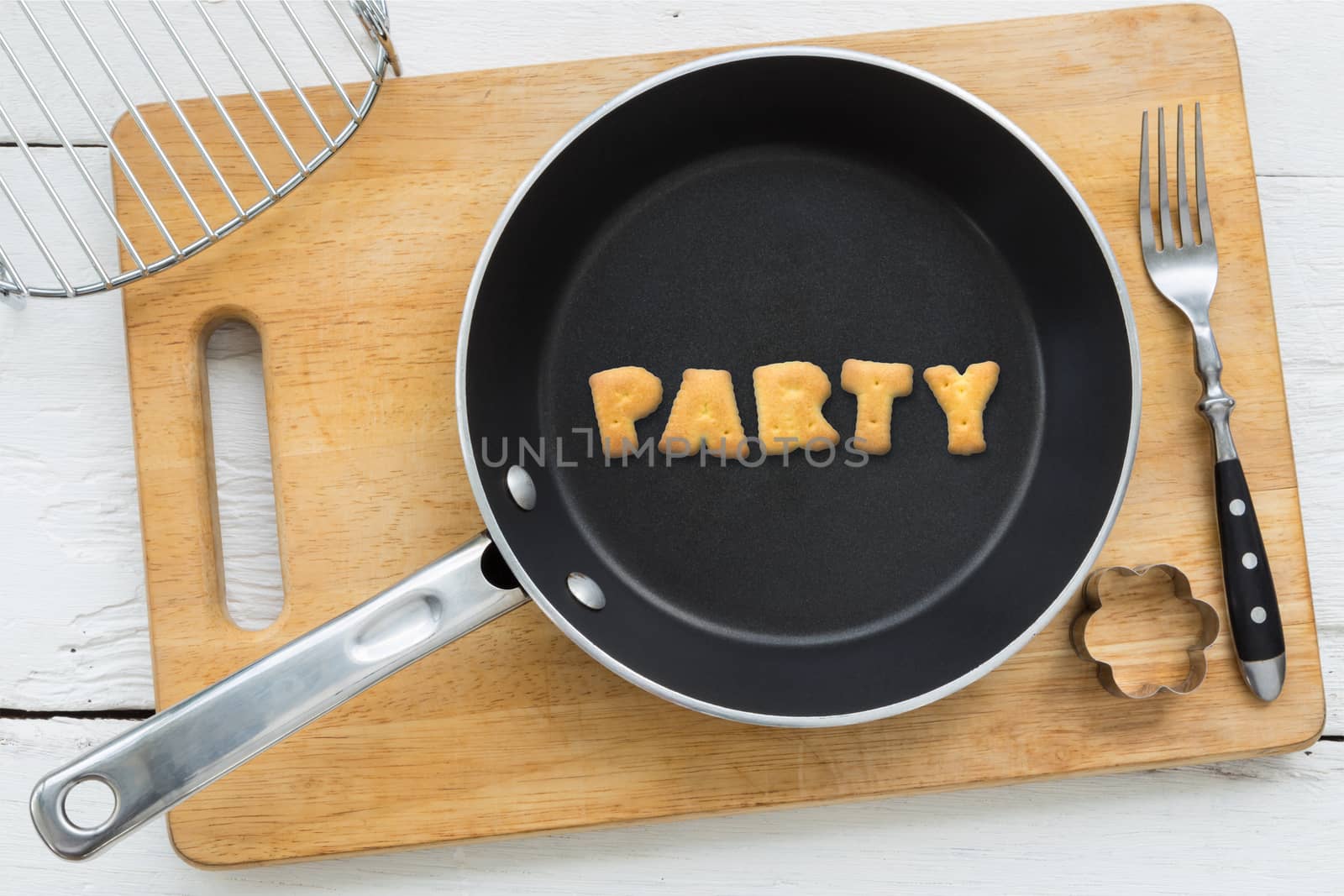 Cookie biscuits word PARTY in frying pan by vinnstock