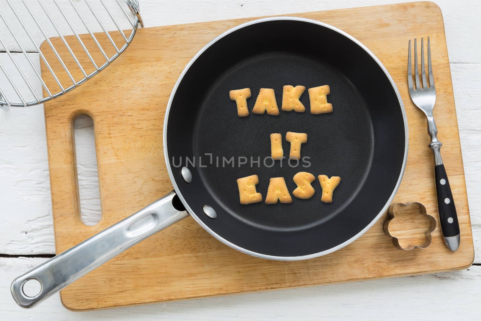 Cookie biscuits quote TAKE IT EASY in frying pan by vinnstock
