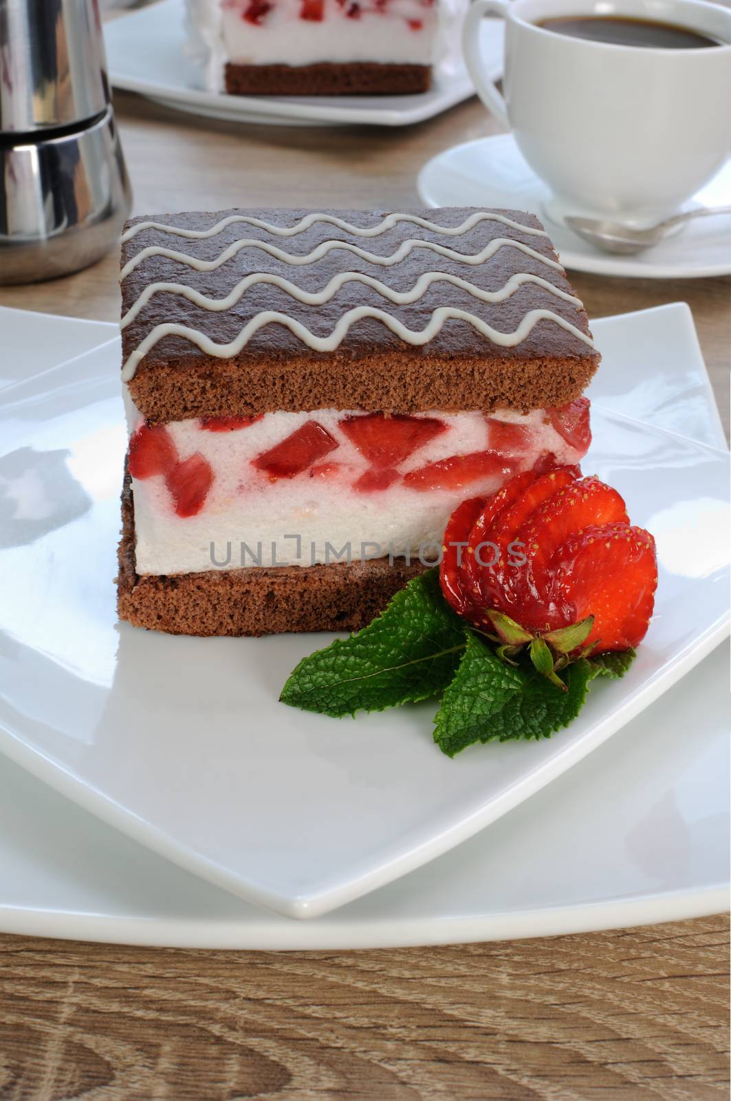 Strawberry souffle on a chocolate sponge cake 