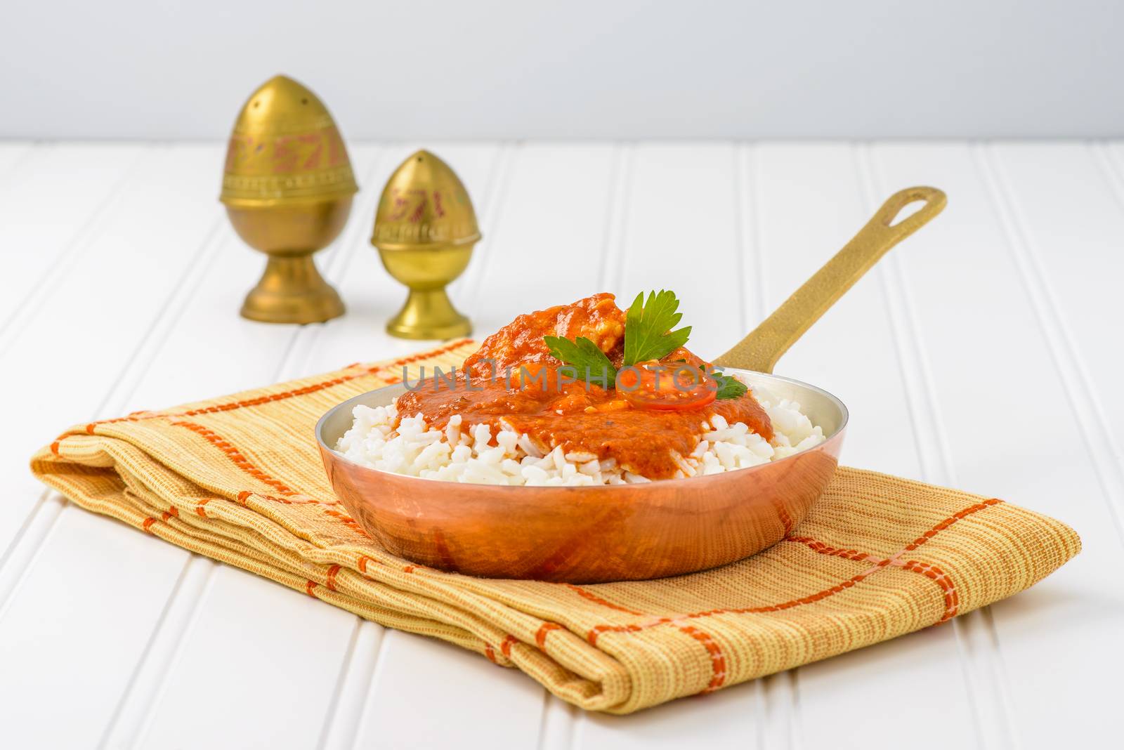 Asian Indian butter chicken served with white rice.
