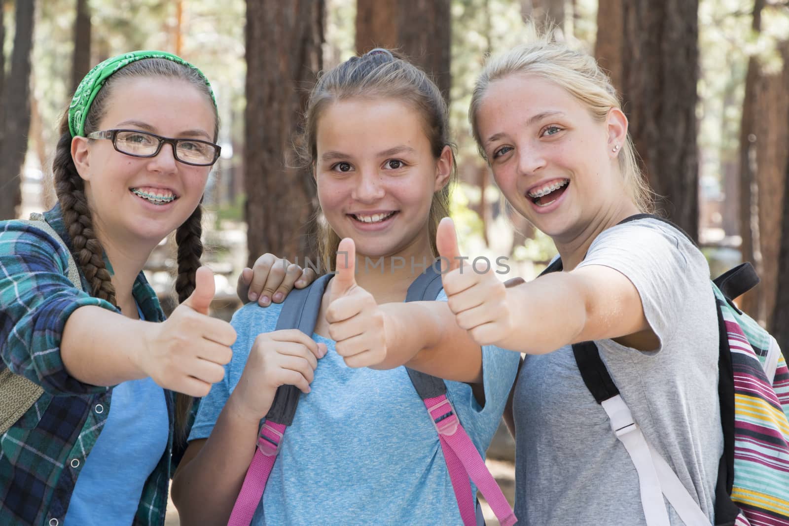 Young Girls with Thumbs up and down