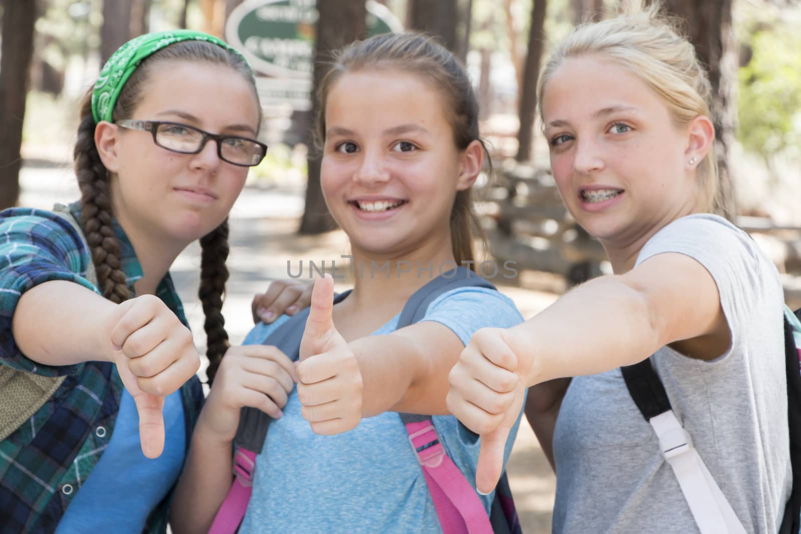 Young Girls with Thumbs up and down