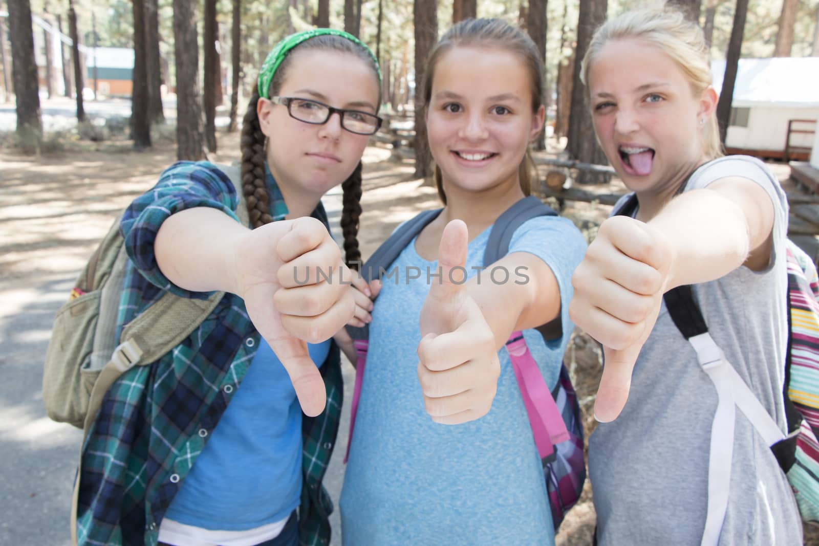 Young Girls with Thumbs up and down