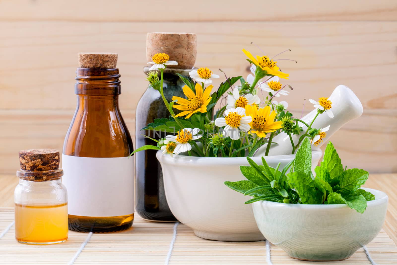 Alternative health care fresh herbal ,honey and wild flower with mortar on wooden background.