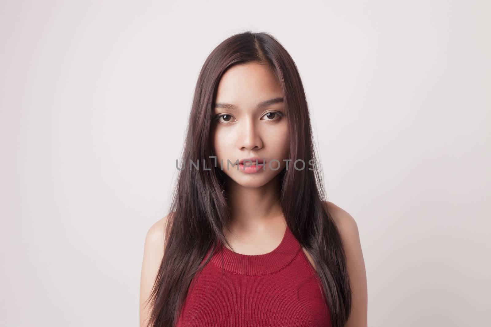 closeup fashion portrait of asian young sexy woman posing in studio .