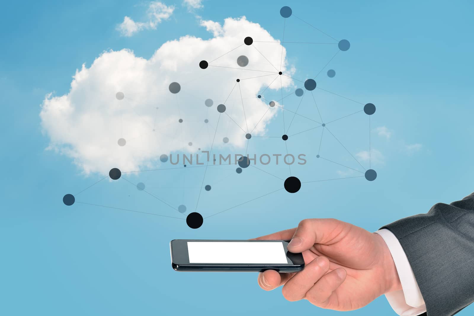 Businessman hand holding smartphone on blue sky background