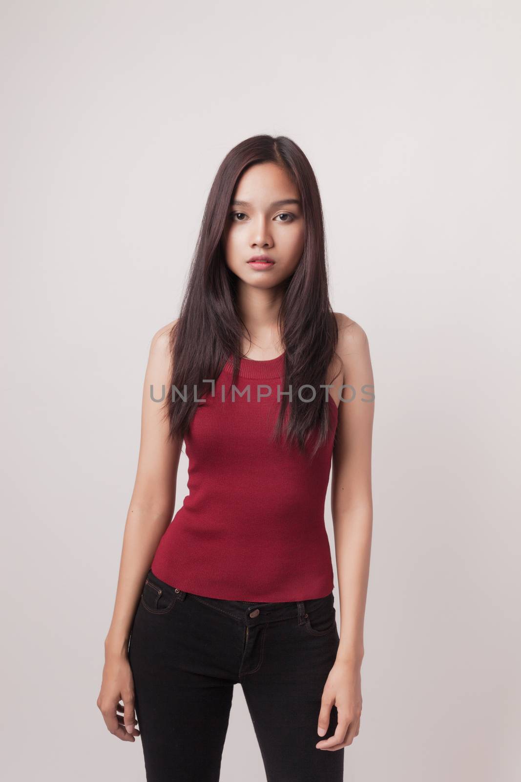 closeup fashion portrait of asian young sexy woman posing in stu by nopparats