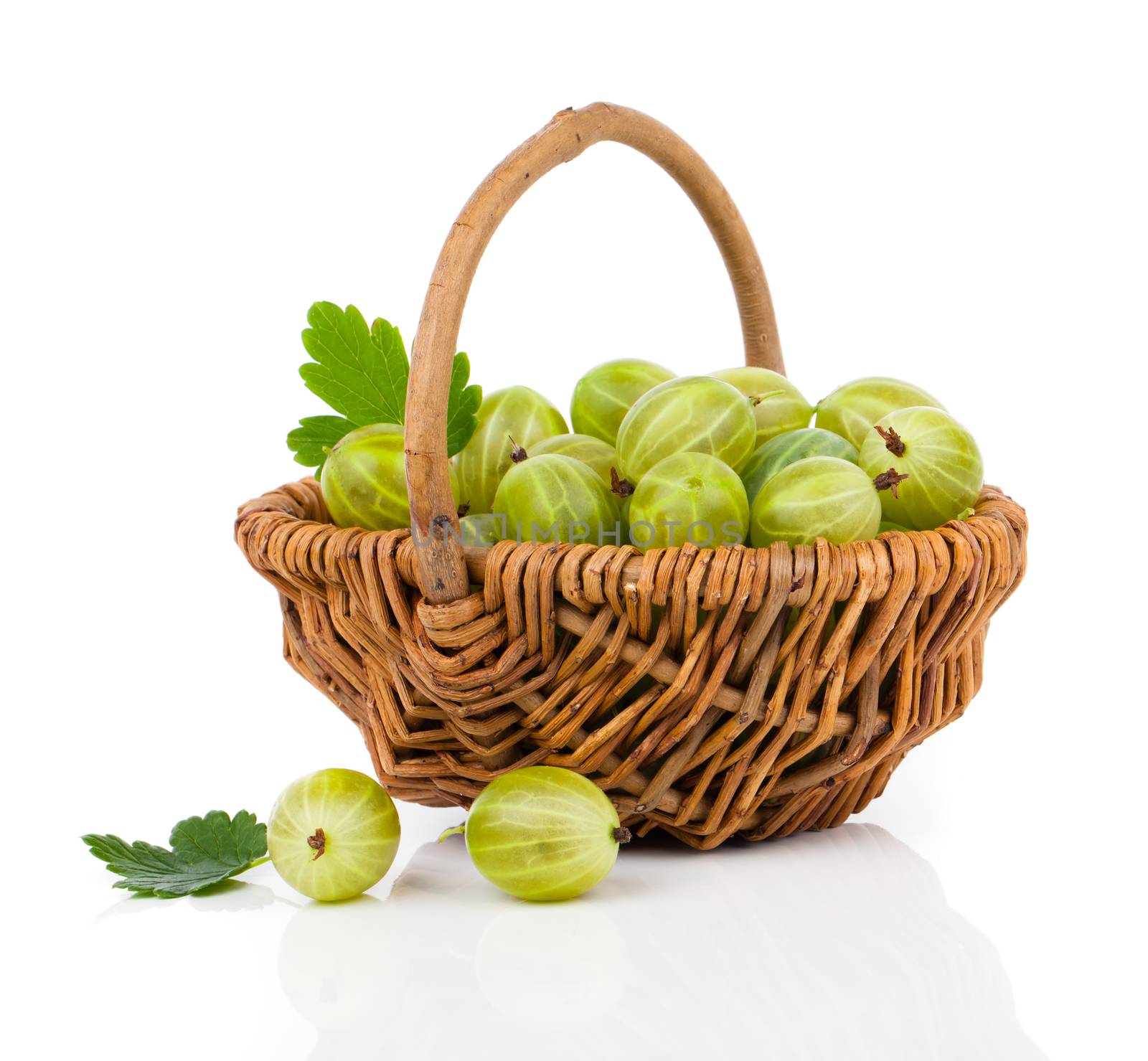 fresh gooseberry in a wicker basket, on a white background