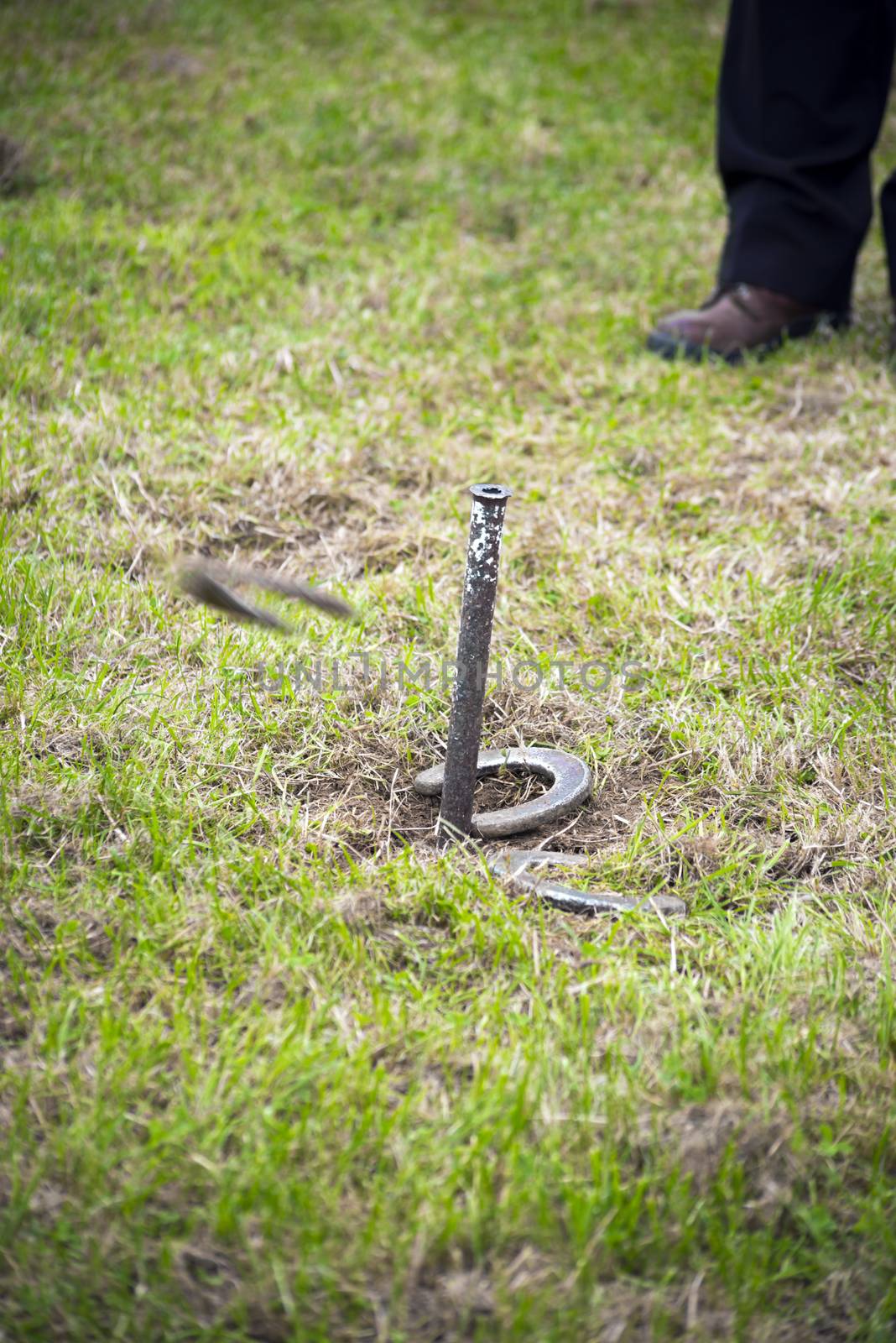 horseshoe pitching competition at a farmers gathering