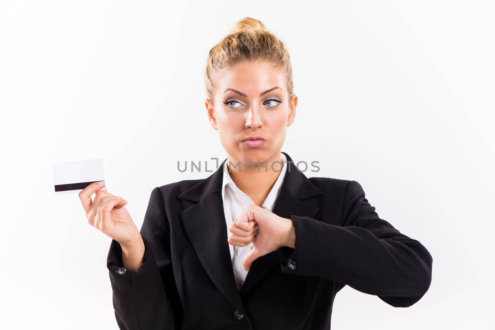 Businesswoman showing thumbs down and holding a credit card.
