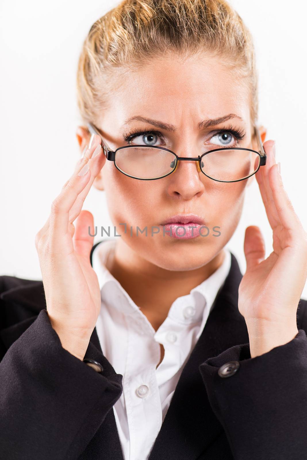 Portrait of attractive businesswoman with glasses. She is worried.