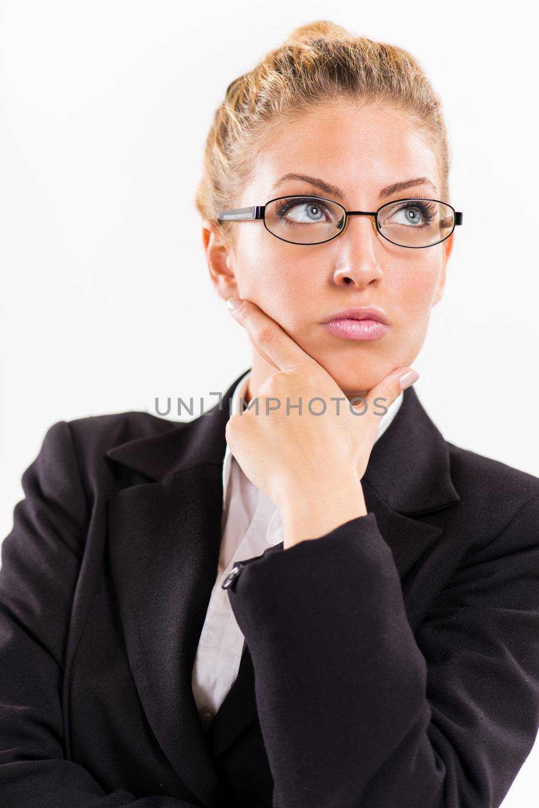 Portrait of attractive businesswoman thinking.