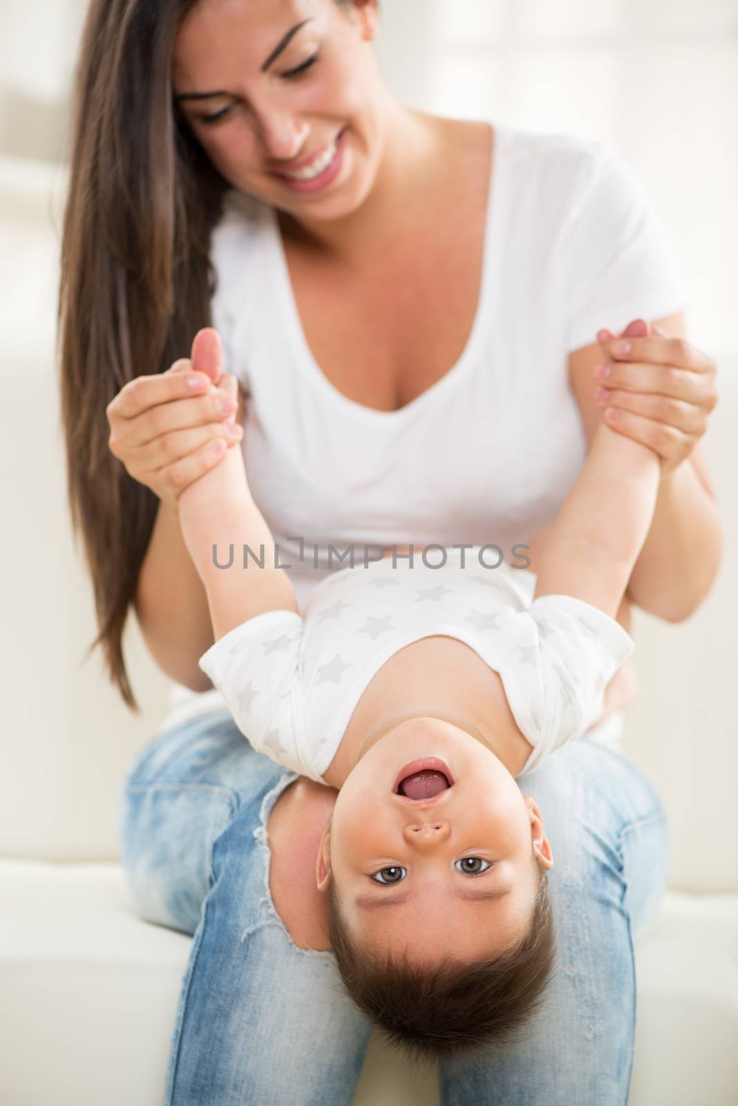 Mother and baby playing at home