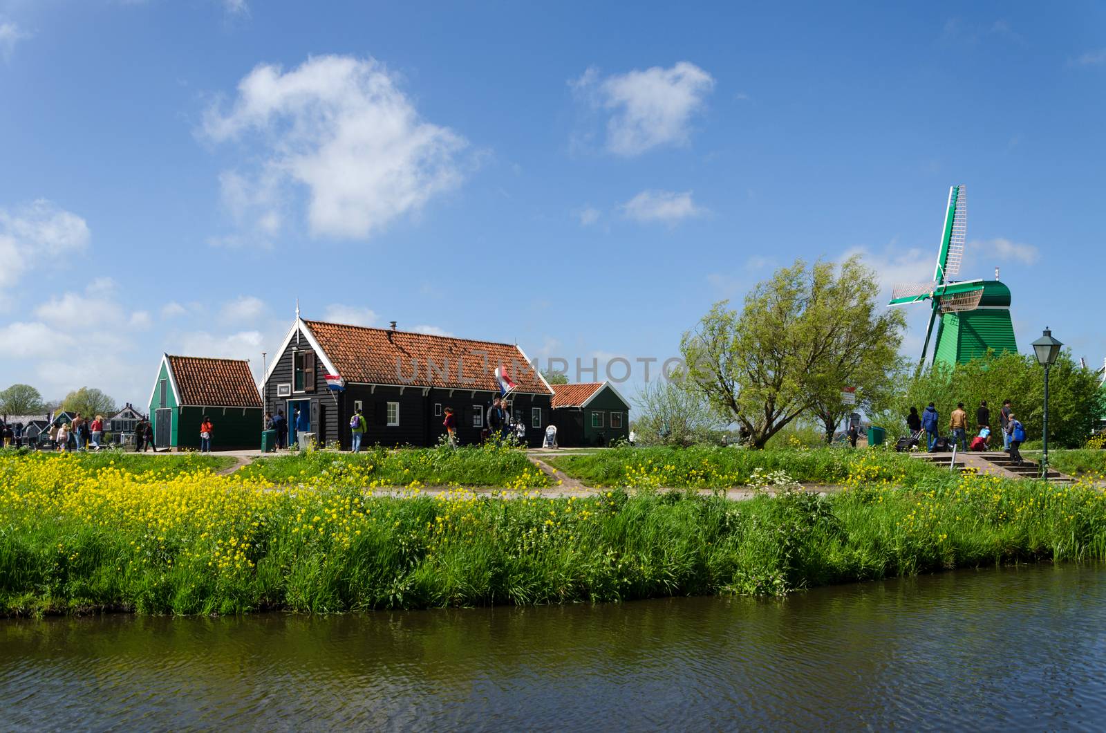 Zaanse Schans, Netherlands - May 5, 2015: Tourist visit Windmills and rural houses in Zaanse Schans by siraanamwong