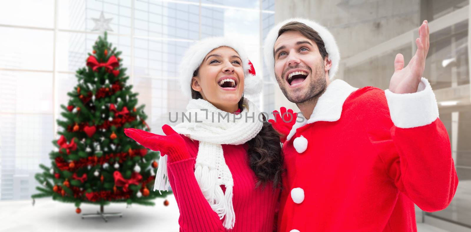 Festive young couple against home with christmas tree