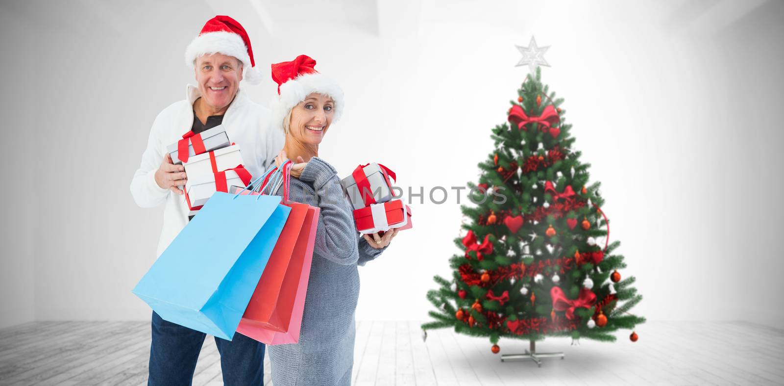 Composite image of couple with shopping bags and gifts by Wavebreakmedia