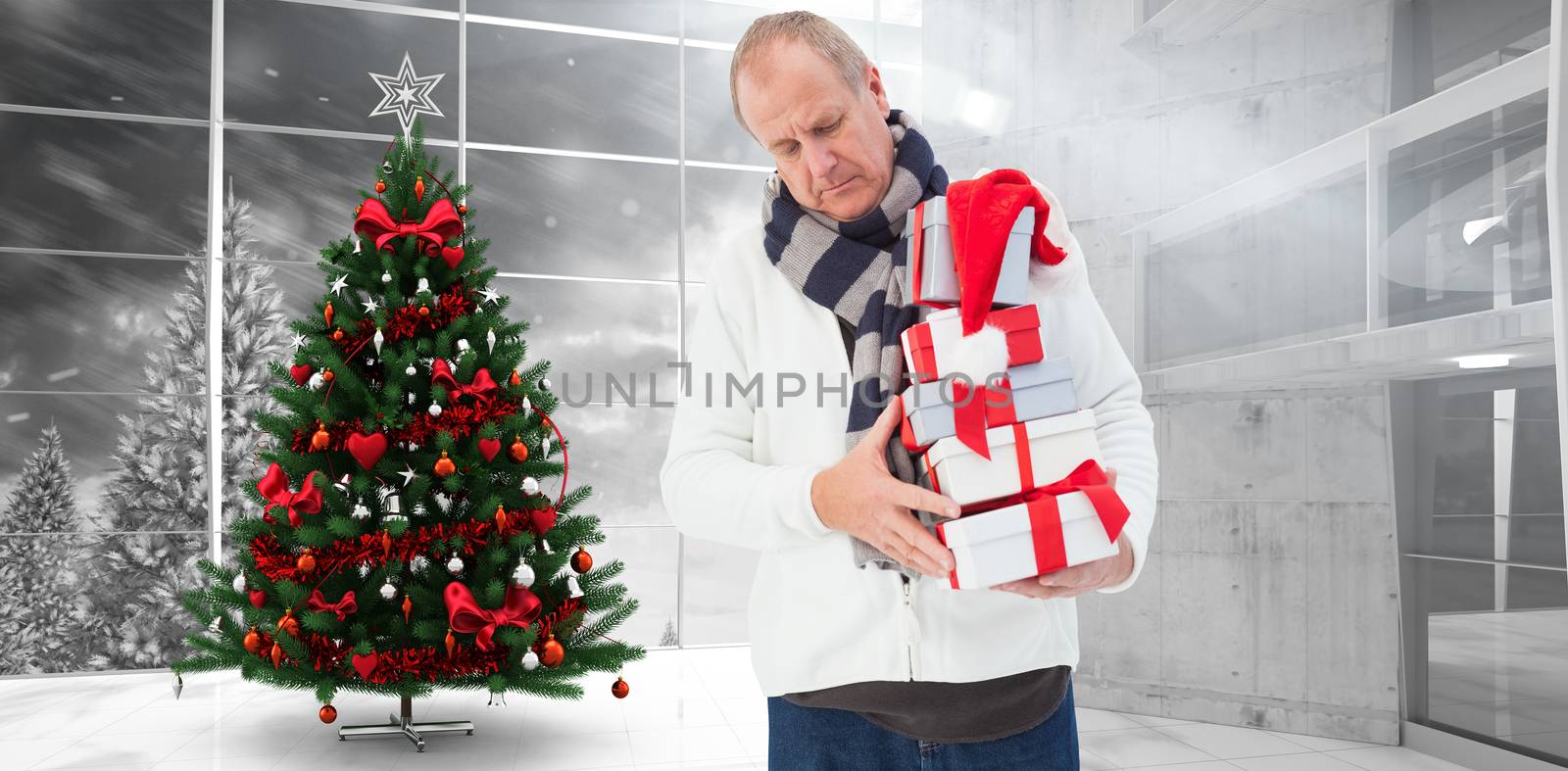 Composite image of festive man holding christmas gifts by Wavebreakmedia