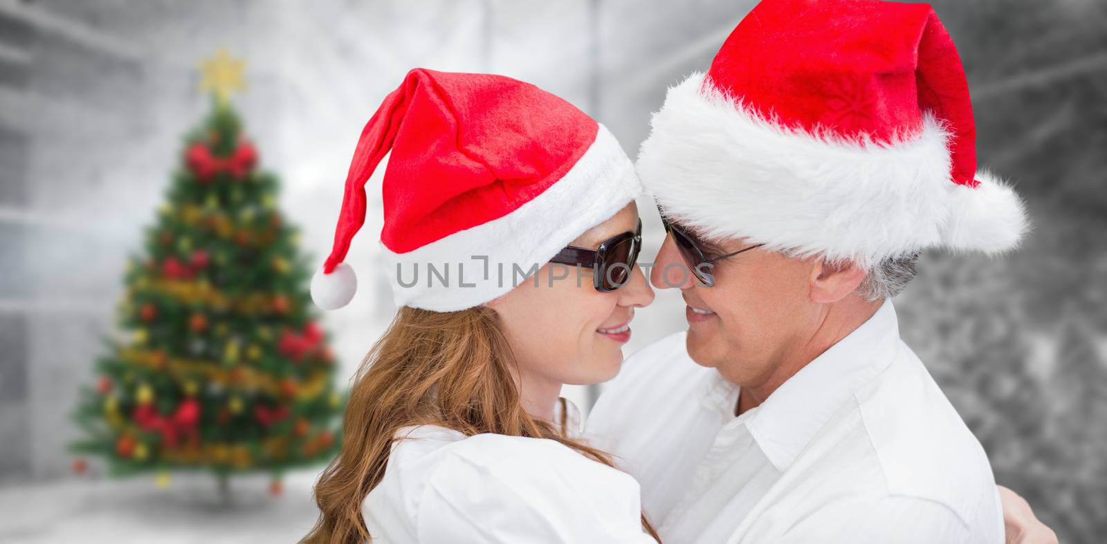 Christmas couple against home with christmas tree