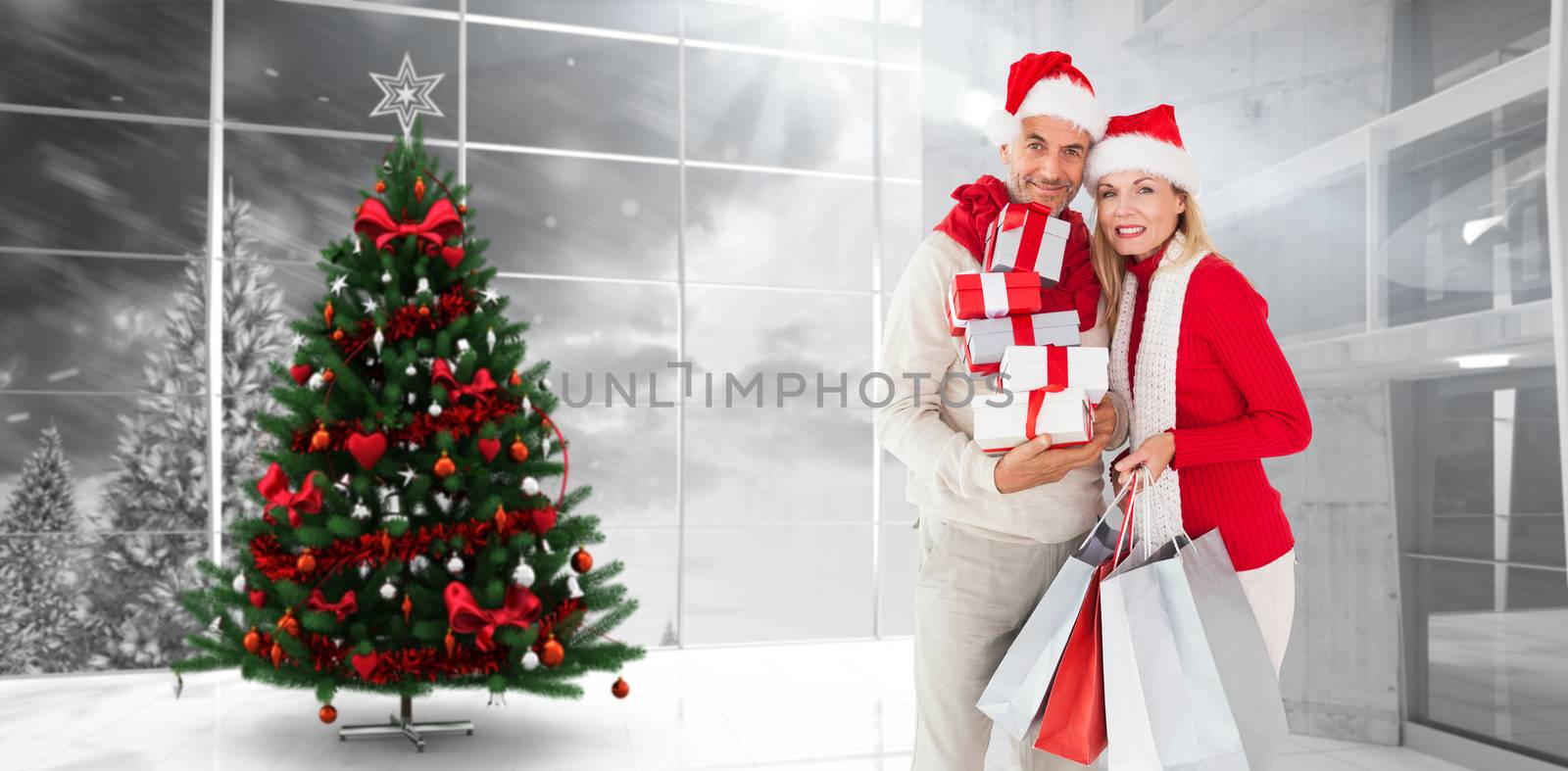 Composite image of happy festive couple with gifts and bags by Wavebreakmedia