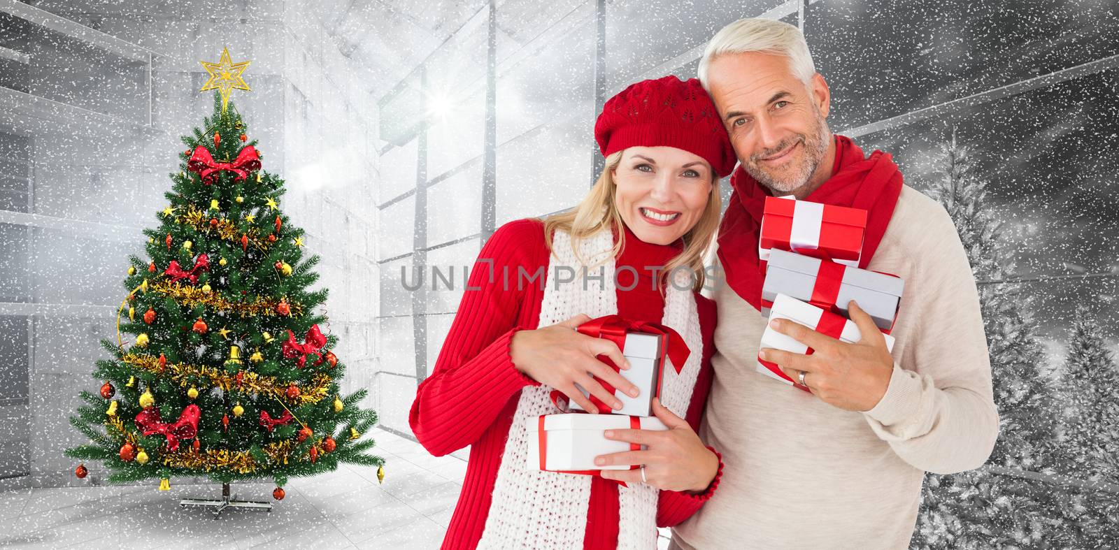 Composite image of happy festive couple with gifts by Wavebreakmedia