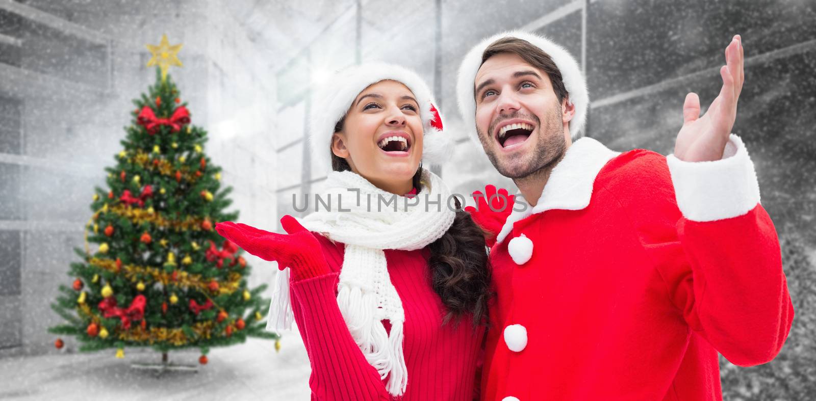 Festive young couple against home with christmas tree