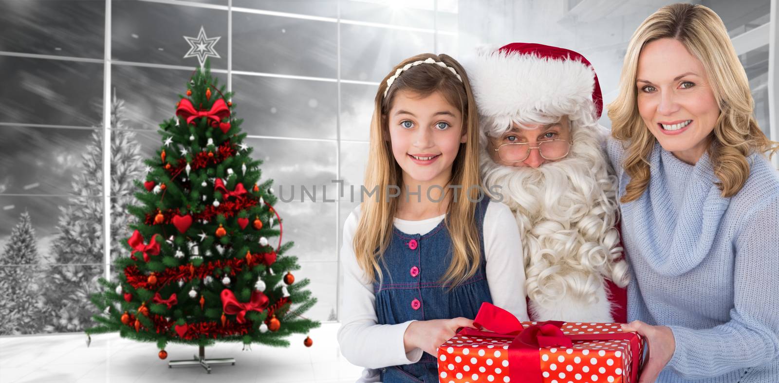 Composite image of mother and daughter with santa claus by Wavebreakmedia