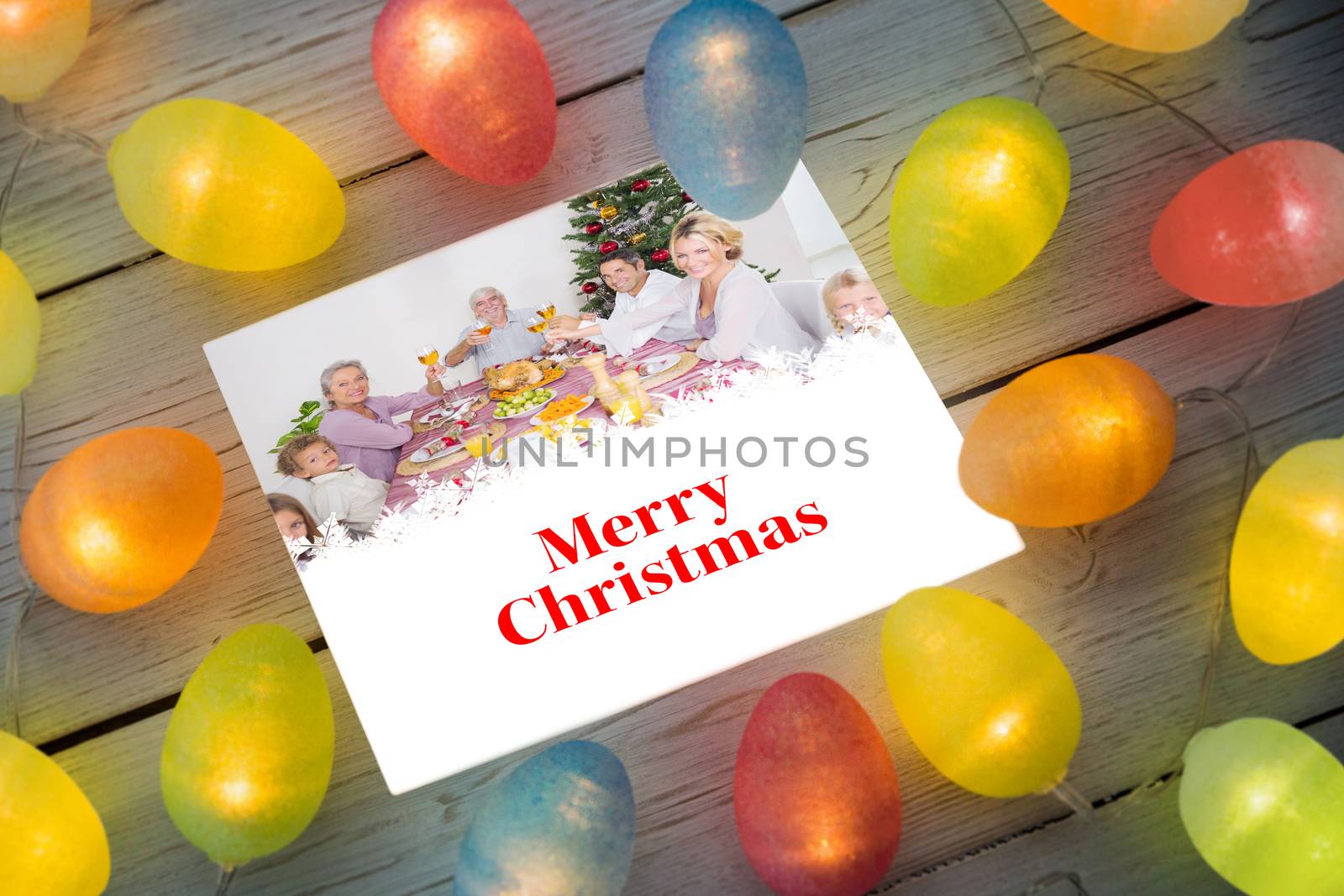 Composite image of christmas lights on table by Wavebreakmedia