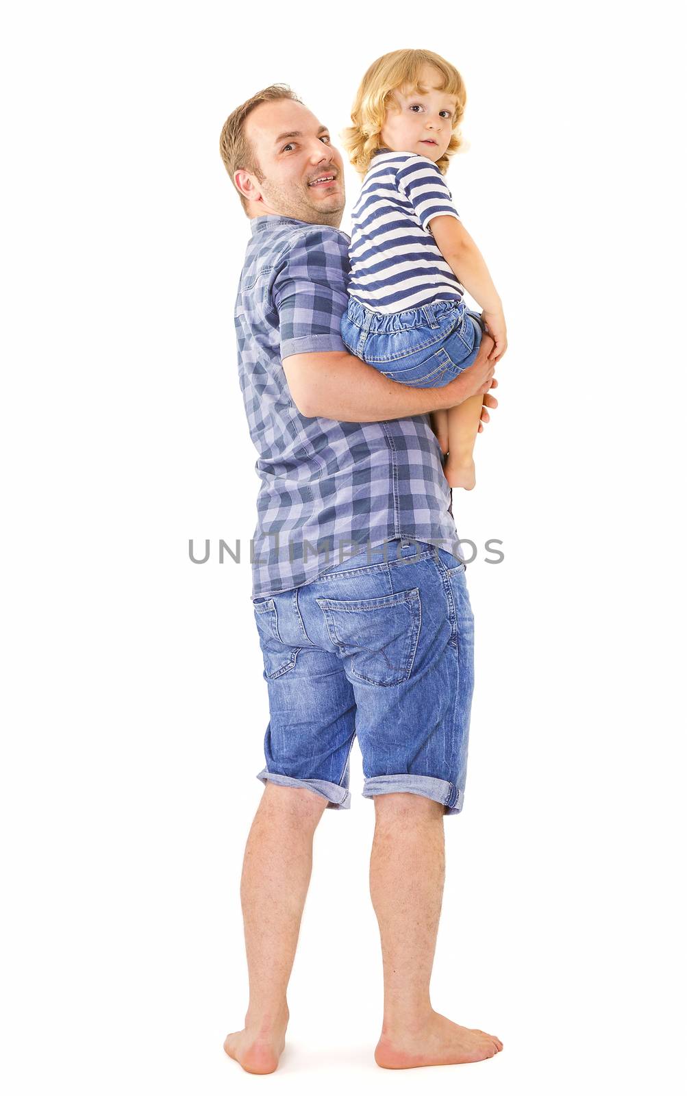 Portrait of young attractive smiling father playing with his little cute son on white background.