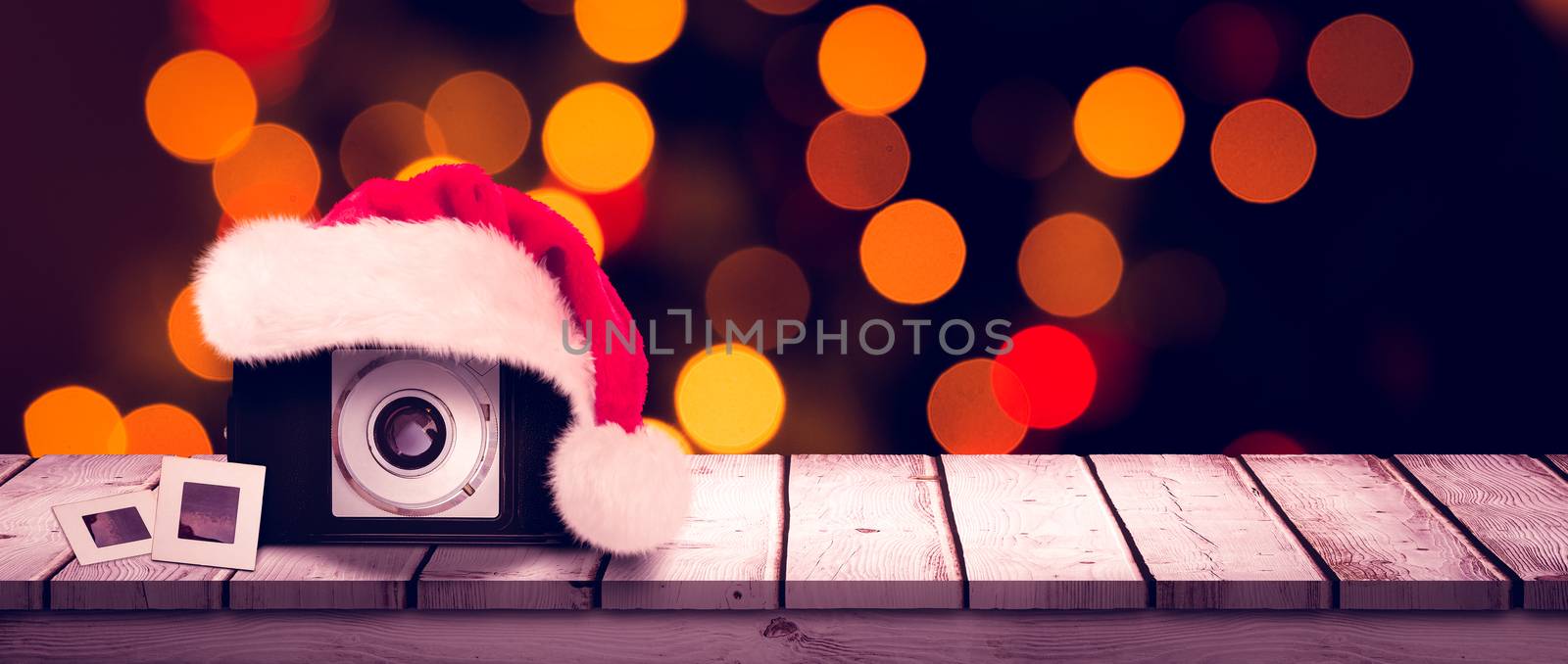 christmas camera against close up of christmas lights