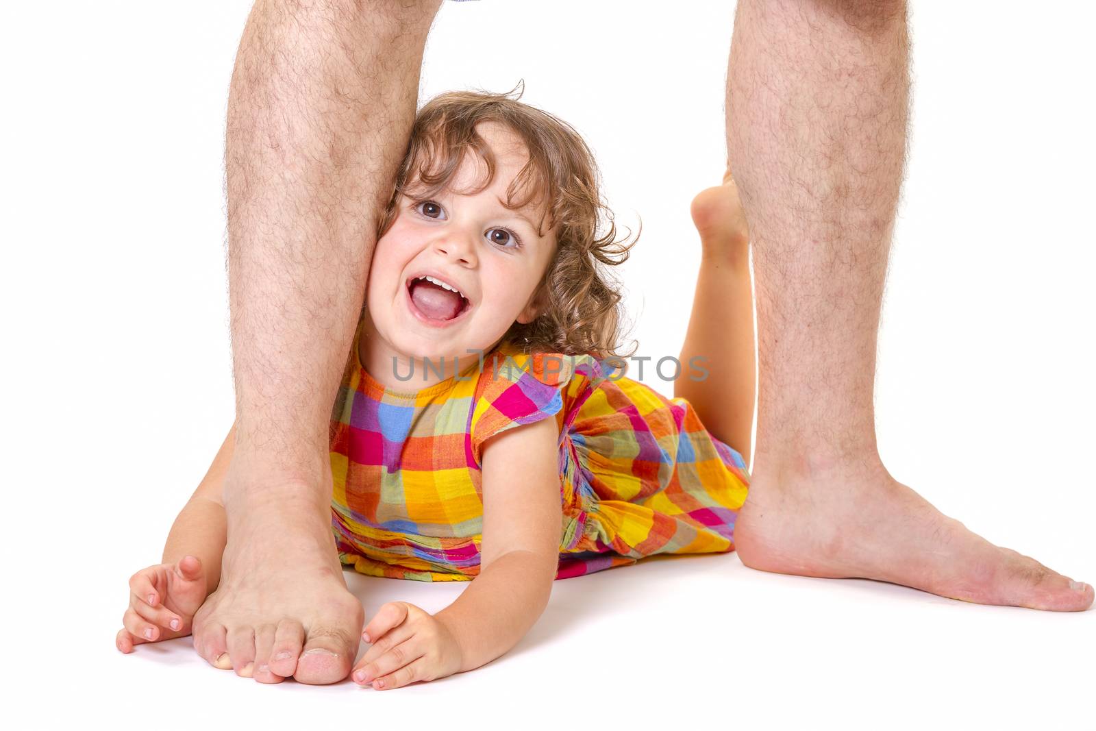 Little daughter at the feet of her father by manaemedia