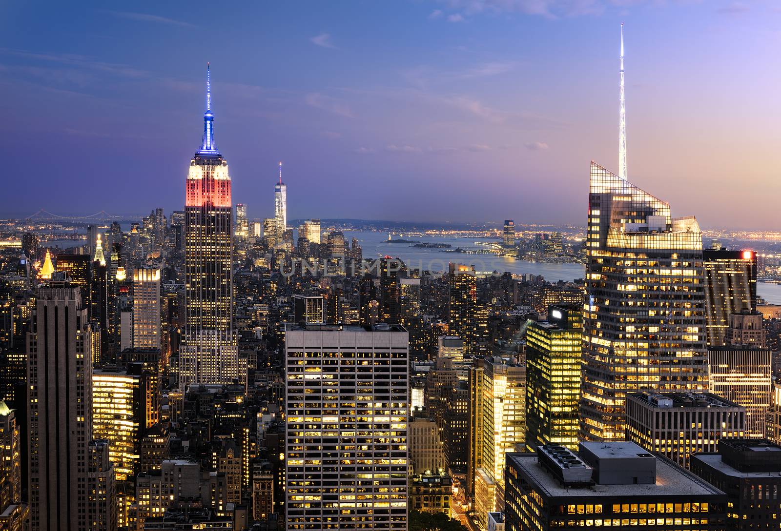 New York City skyline with urban skyscrapers at sunset, USA.