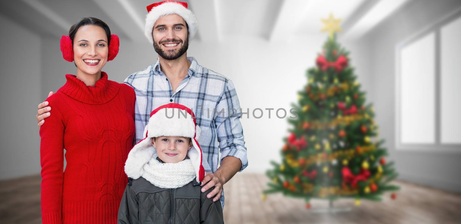 Composite image of happy family looking at camera  by Wavebreakmedia