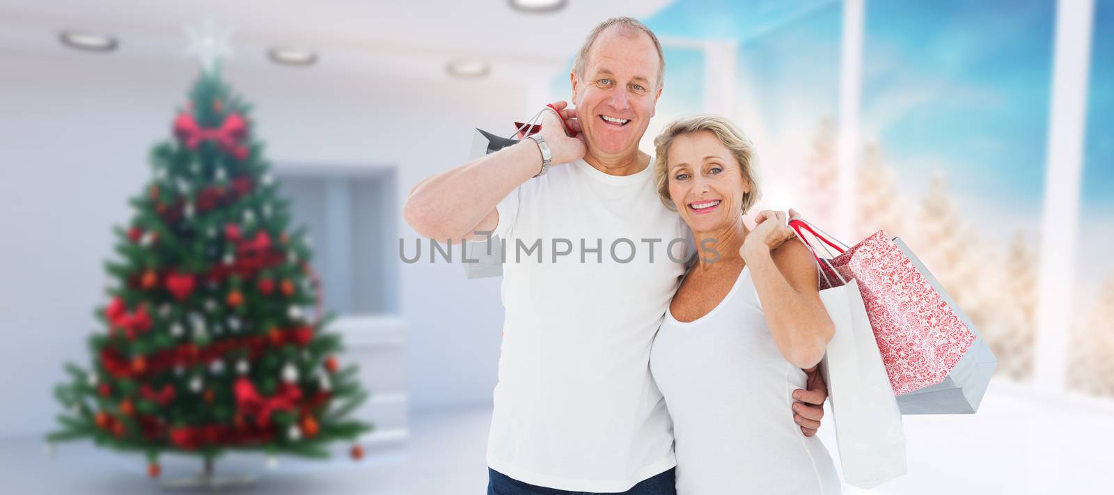 Couple with shopping bags against home with christmas tree
