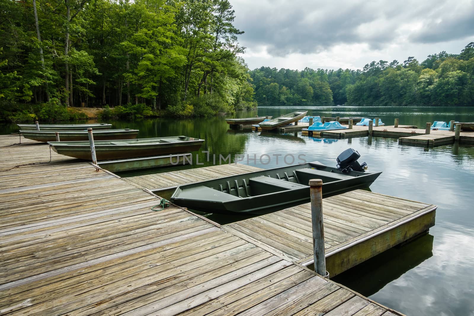 Aluminium bass fishing boat at wooden dock in Virginia, America USA