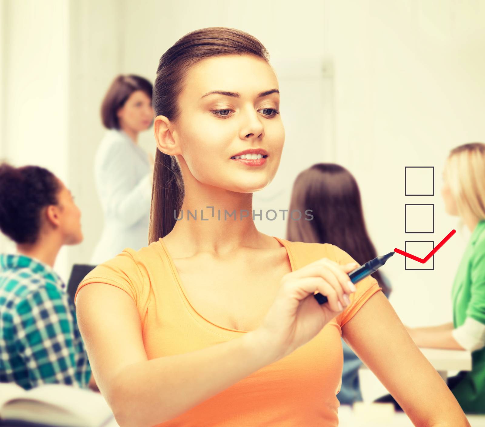 education and technology concept - student drawing checkmark on virtual screen