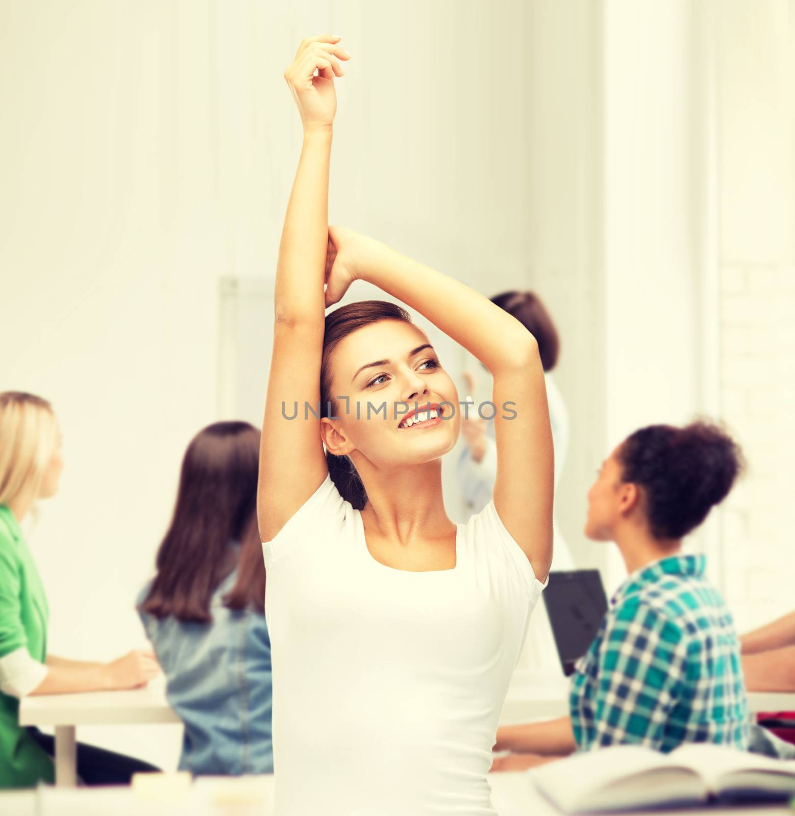 education and success concept - happy student girl with hands up