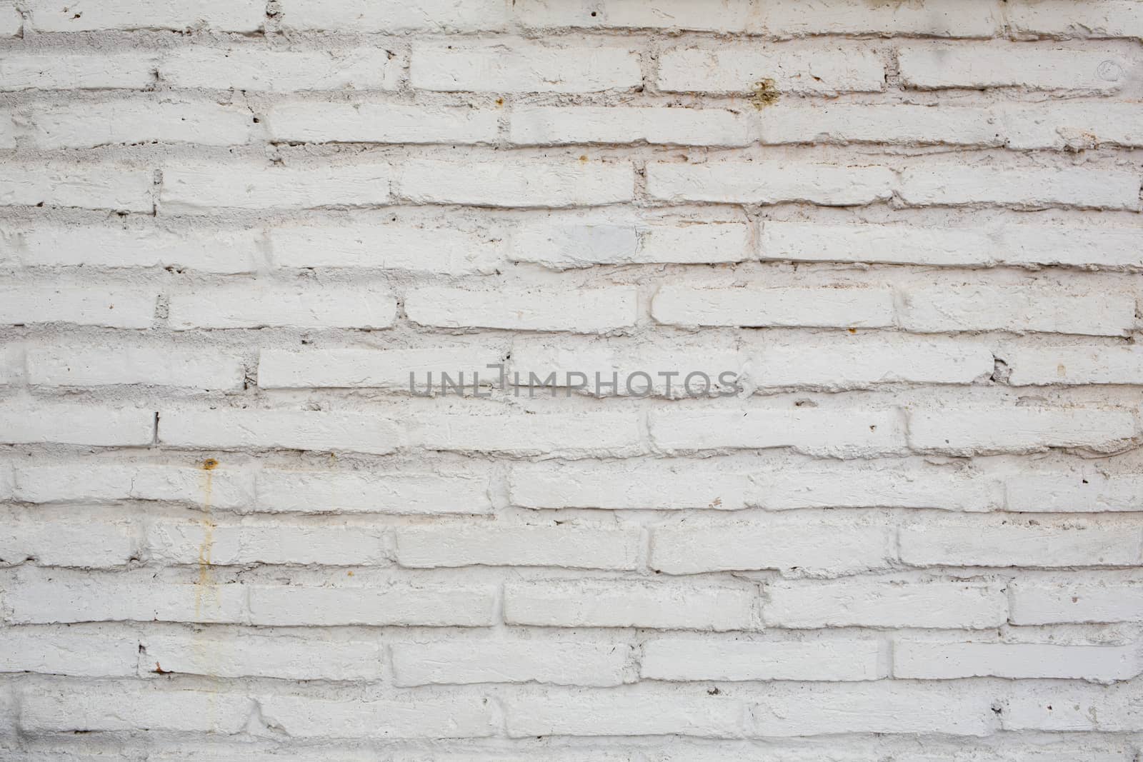Abstract weathered texture stained old stucco light gray and aged paint white brick wall background in rural room, grungy rusty blocks of stonework technology color horizontal architecture wallpaper