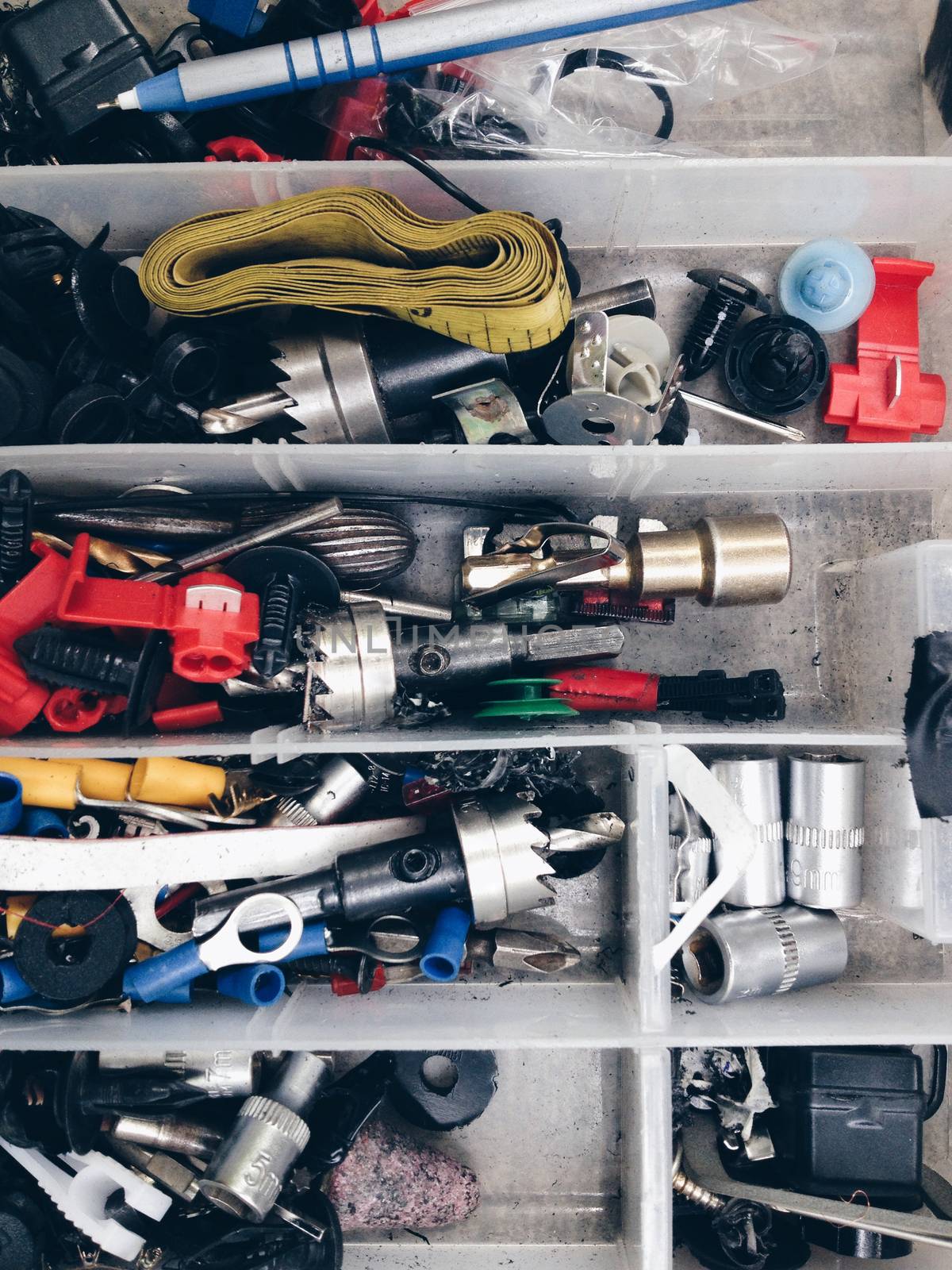 Close up of Nuts, bolts and screws in box background