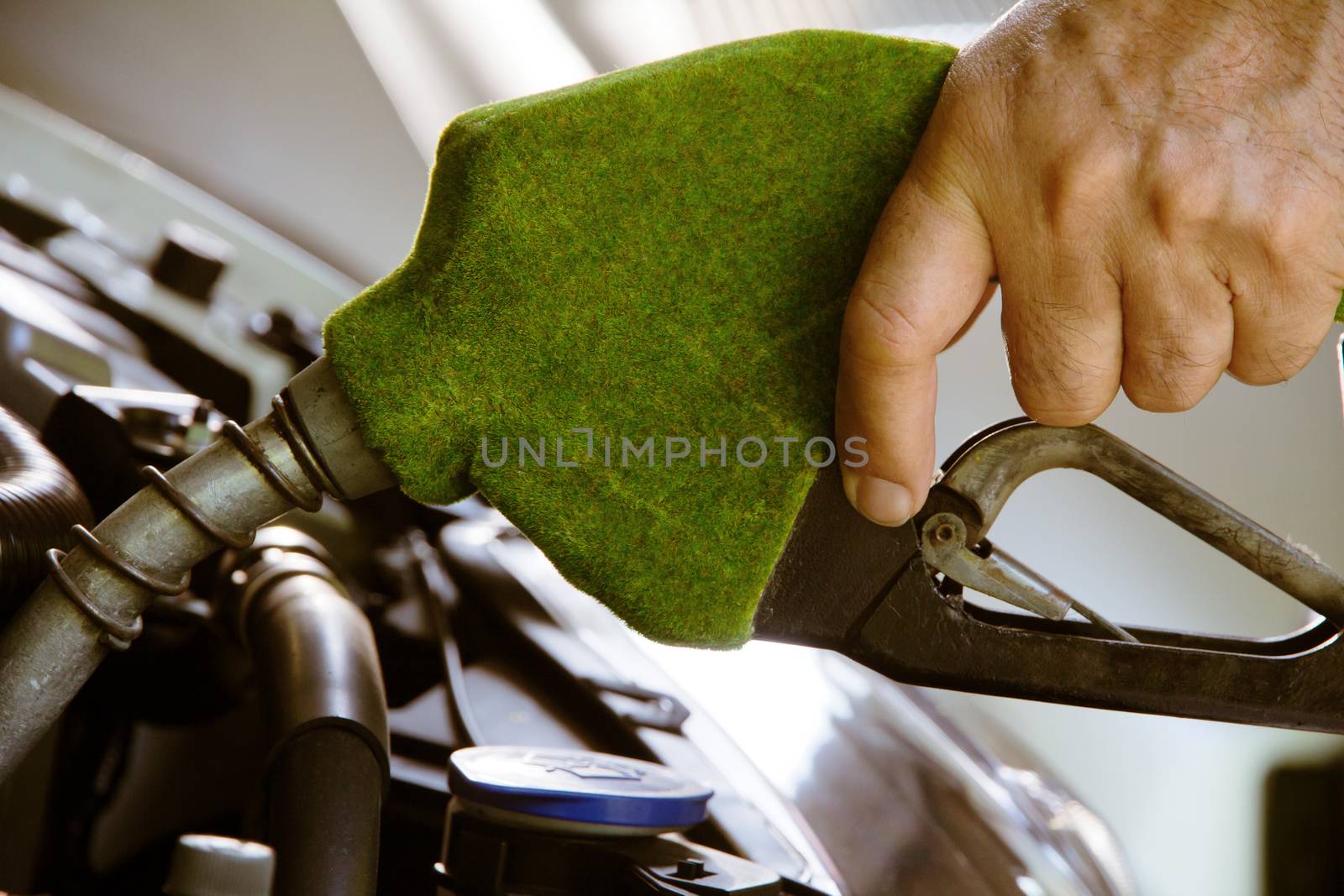 green fuel nozzle,Fill up the gas tank concept