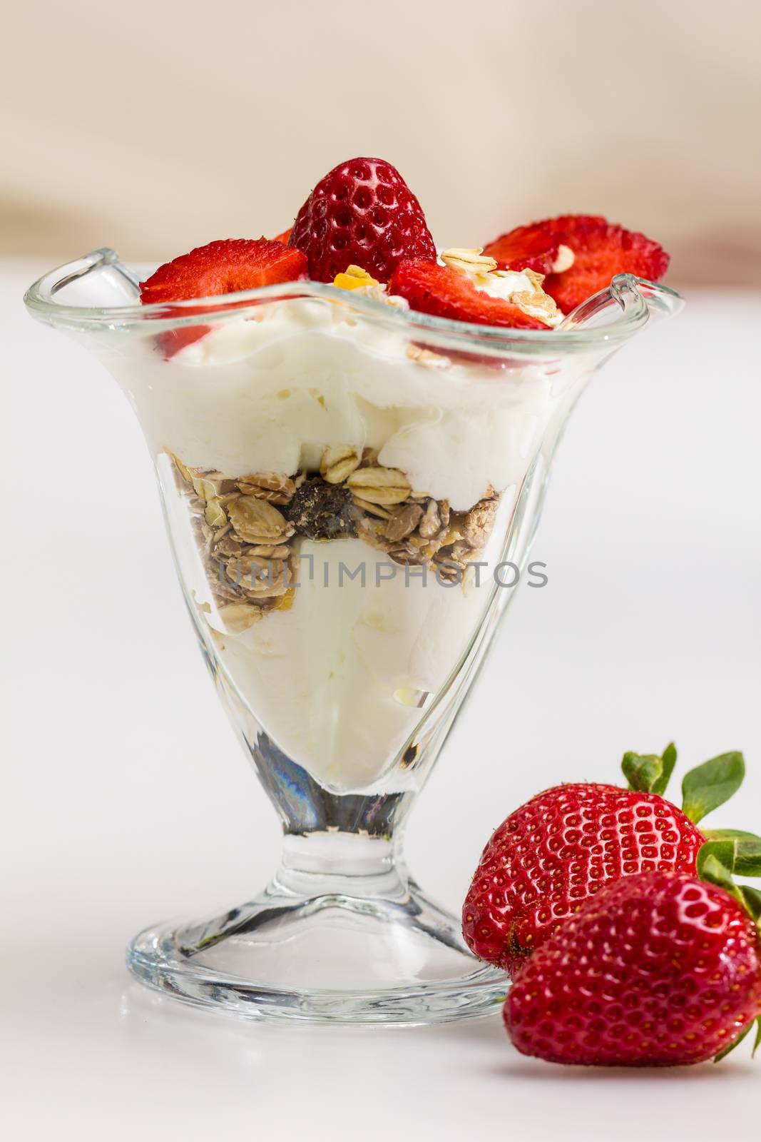 Glass of Muesli with strawberries and yogurt