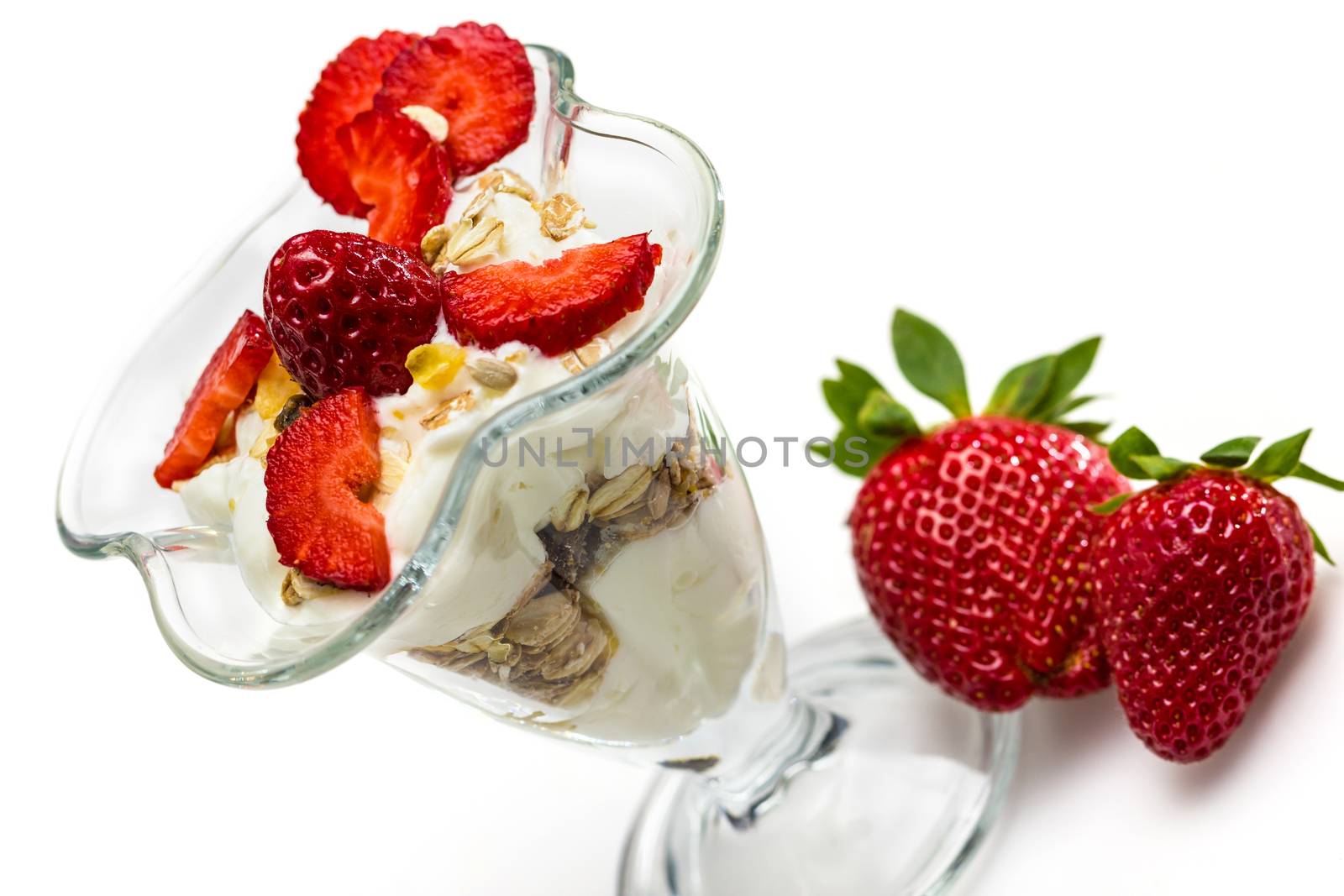 Glass of Muesli with strawberries and yogurt