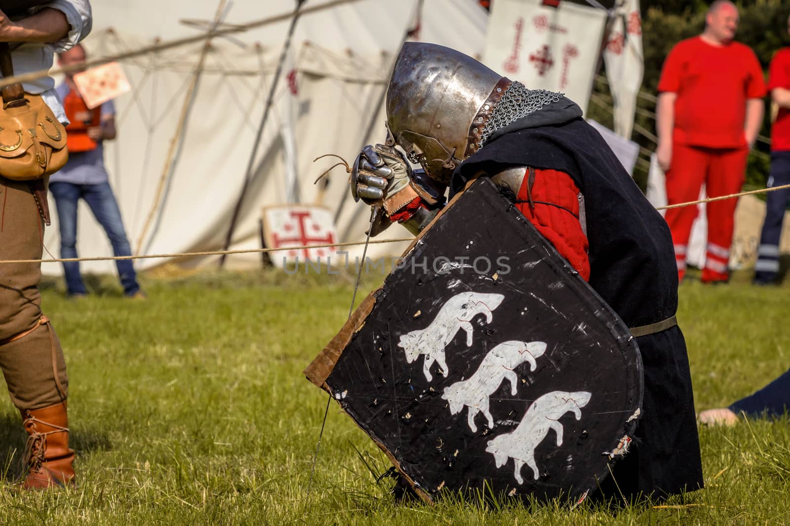 CHORZOW,POLAND, JUNE 9: Medieval Knight praying before fight during a IV Convention of Christian Knighthood on June 9, 2013, in Chorzow