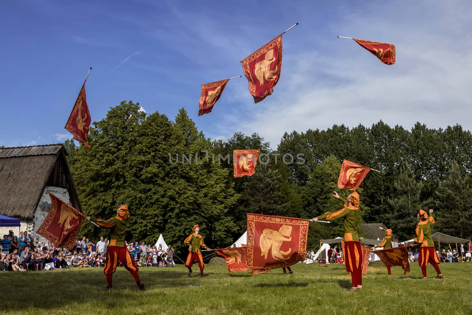 CHORZOW,POLAND, JUNE 9: "Gwardia Gryfa" team performing flag dance during a IV Convention of Christian Knighthood on June 9, 2013, in Chorzow