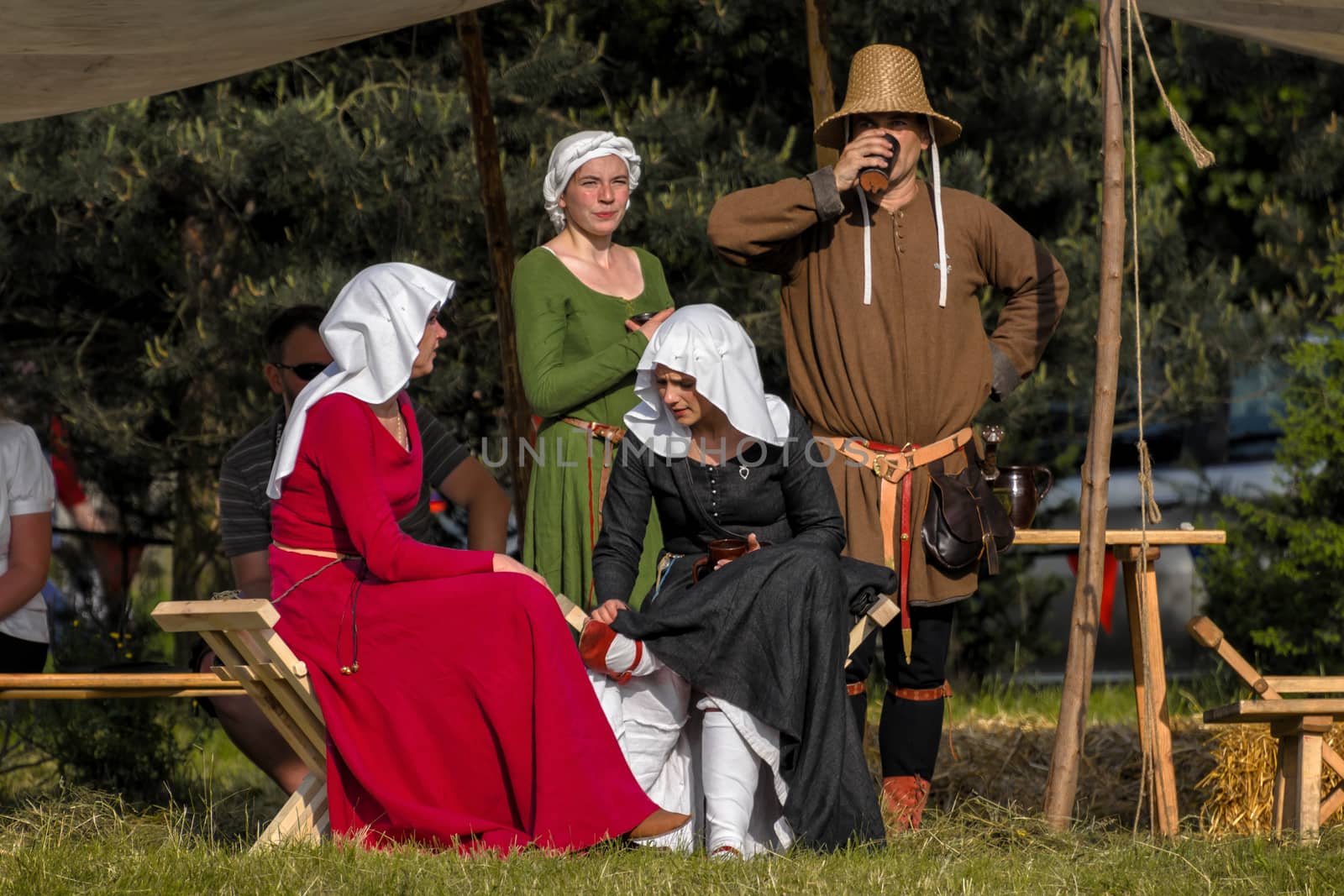 CHORZOW,POLAND, JUNE 9: Medieval townspeople watching the fight  by Attila