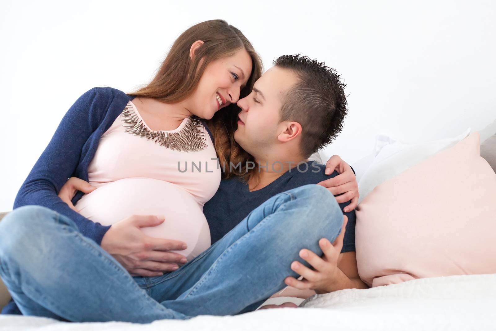 Young pregnant couple is waiting for their little girl