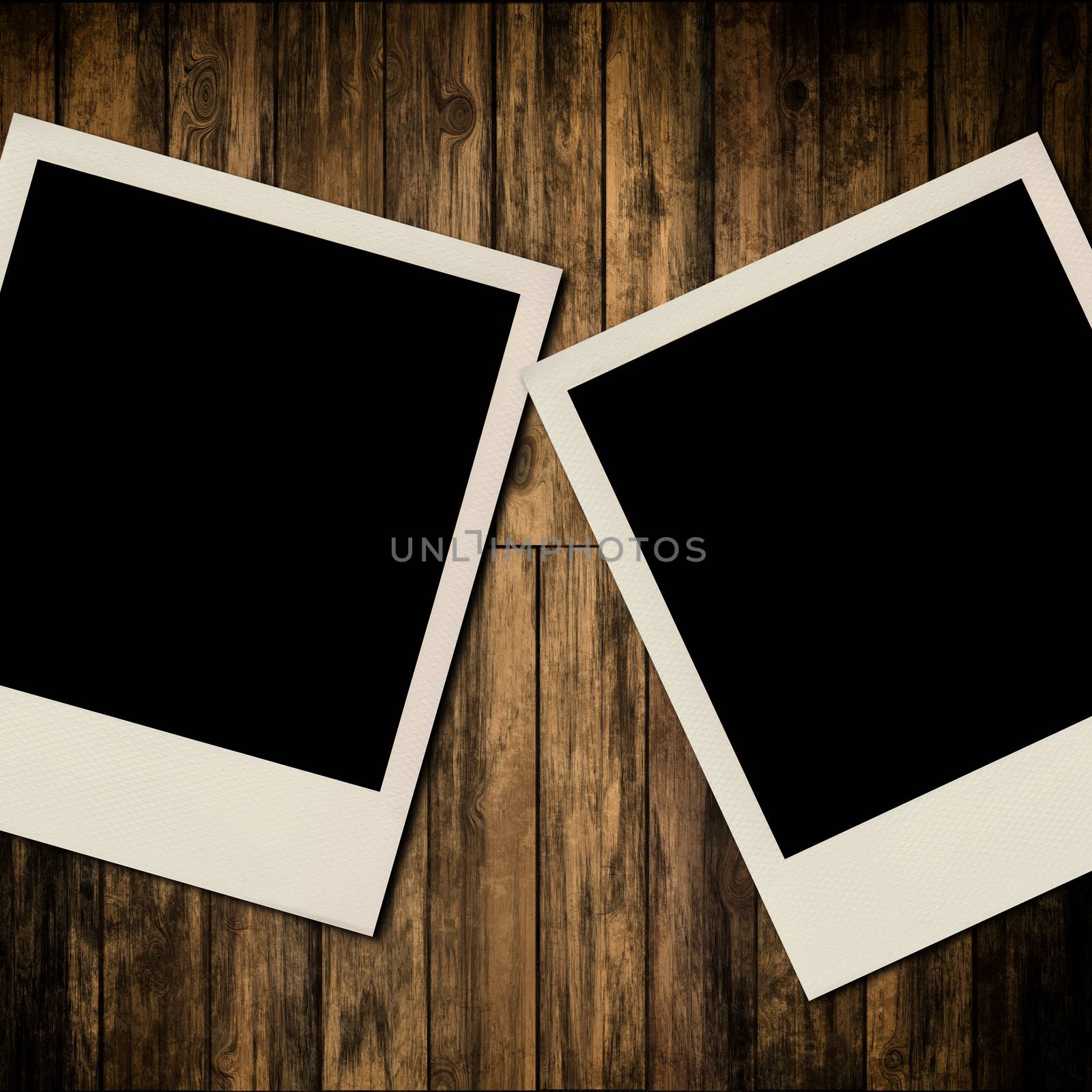 Blank instant photo frames on old wooden background by Attila