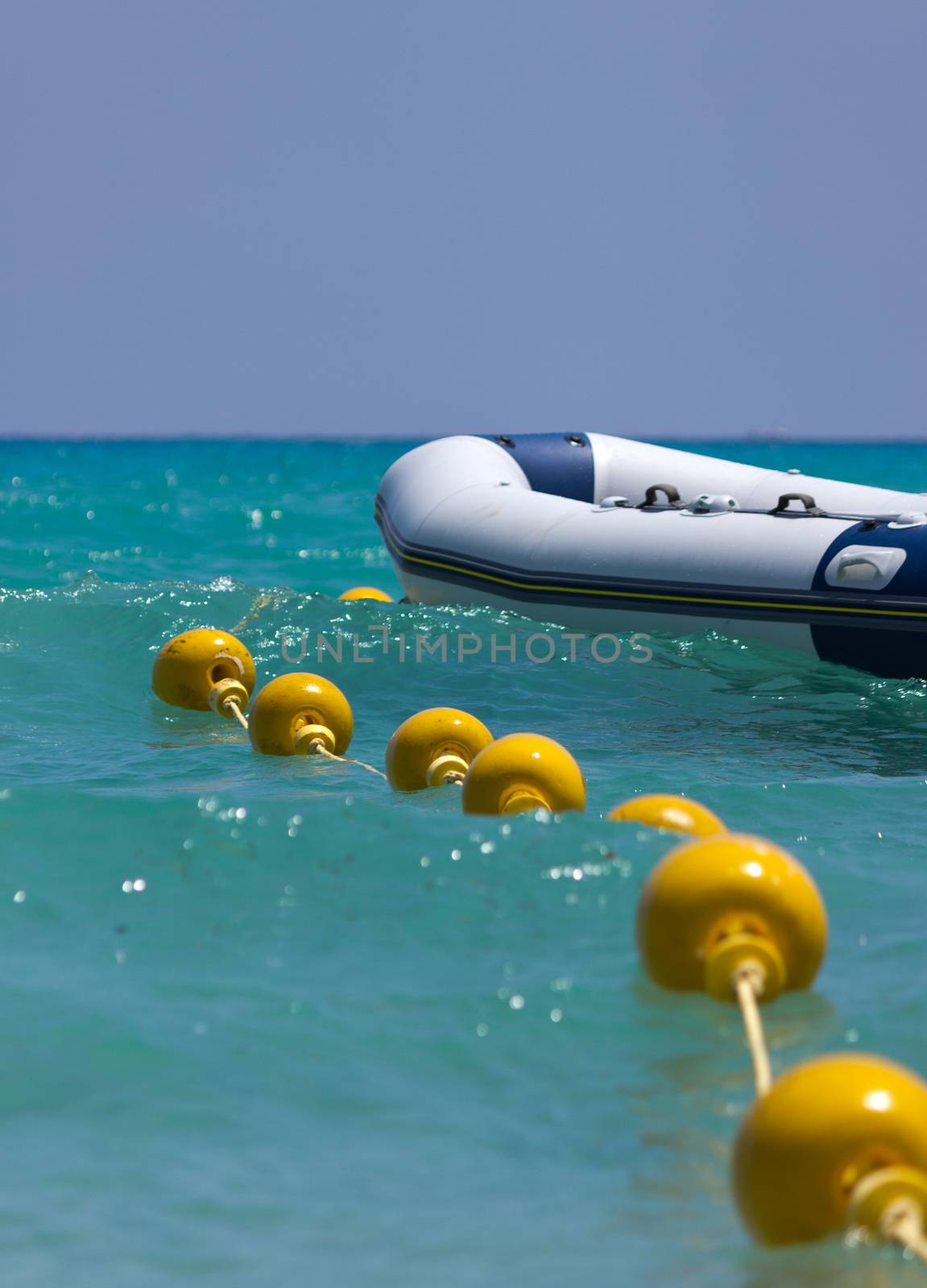 Boat and a buoy floating on the sea